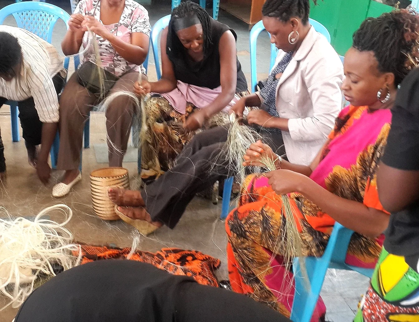 People working with basket weaving fibres